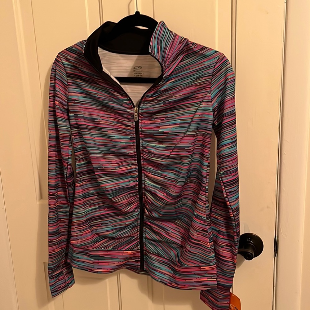 Champion duo dry zip up jacket girls size extra-large with Tom holes in sleeves